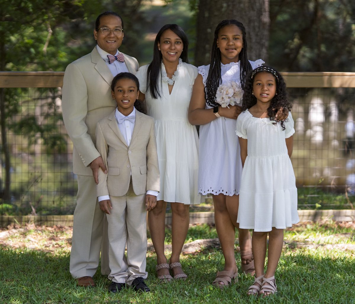 Dr. James M. Thompson I with Dr. Danna Thompson and their three children in a formal family portrait